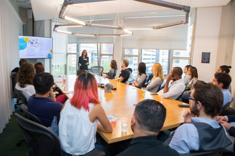 Group of people listening to a presentation
